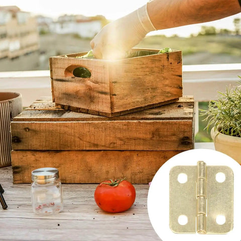 20 Pieces Dollhouse Mini Hinges Hardware Set For Small Furniture Cabinets And Closets 1 To 12 Scale With 80 Screws Yellow Antique Brass Finish Durable Stainless Steel Alloy Perfect For Jewelry Boxes And Dollhouse Miniatures shown with wooden boxes and a tomato