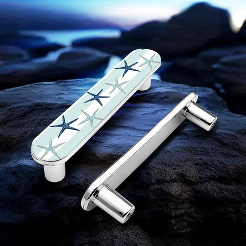 Blue Starfish Cabinet Pulls 4 Pack Center To Center Three Quarter Inch Silver Nautical Drawer Handles on rocks