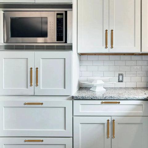 Installed 10 Pack 5 Inch Cabinet Pulls Antique Brass Zinc Alloy Drawer Pulls on white kitchen cabinets