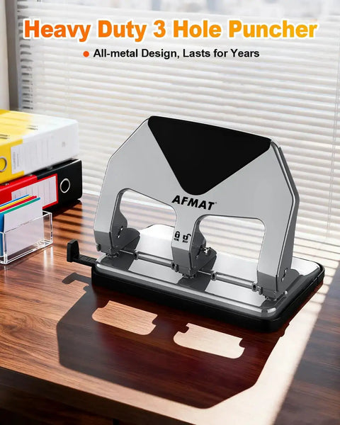 Heavy-Duty 3 Hole Punch For Binders, 50-Sheet Capacity, stainless steel, on office desk, boss-level durability, home office use