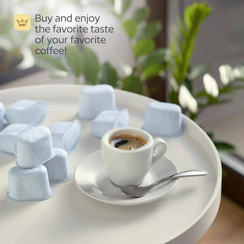 12 Breville BWF100-compatible charcoal water filters, light blue tablets, on a white tray beside an espresso cup