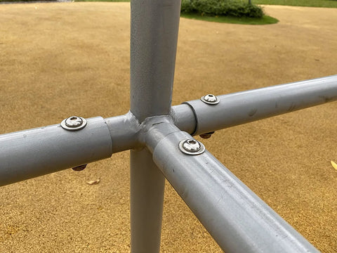 HELIFOUNER flat washers on a gray metal pipe frame joint with bolts; stainless steel hardware.