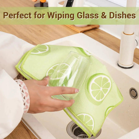 Person using 12 Pack Microfiber Cleaning Cloths For Cars And Home, Absorbent And Lint Free, green cloth with lemon pattern for wiping glass