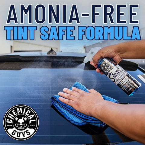 Person applying Streak Free Glass And Window Cleaner That Delivers Crystal Clear Windows For Car, Truck, SUV And Home, Mirrors And Navigation Screens, Ammonia Free And Safe On Tinted Glass 473 Ml From Chemical Guys on a tinted car window.