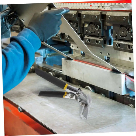 Manual Metal Bender Tool With Straight Jaw Hand Seamer for duct crimping displayed on a metalwork table next to machinery.