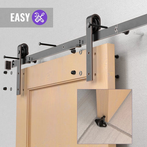 Orb Oil Rubbed Bronze Sliding Barn Door Hardware Kit With 6.6 Foot Track Rails installed on wooden door, showing J shape rollers.