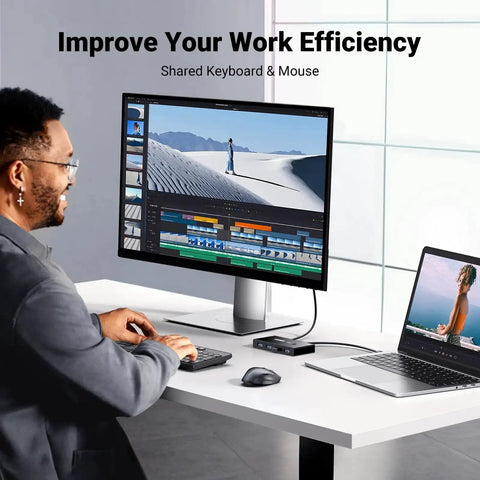 Two In Four Out USB 3.0 Switcher for Two Computers with Four Shared USB Ports on desk setup with monitor and laptop