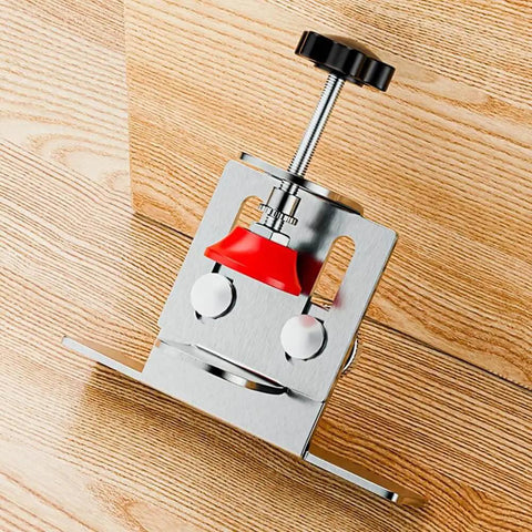 Close-up of Effortless Cabinet Door Installation Tool Kit with adjustable clamp and positioner on wooden surface