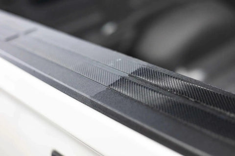 Close-up of car exterior showing restored black trim using Trim And Exterior Plastic Restorer With UV Protection Up To 2 Years 50 Ml