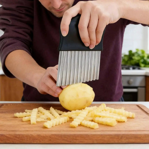 Person using Crinkle Cut Potato Cutter And French Fry Slicer With A Durable Stainless Steel Blade For Kitchen And Cooking Delivers Uniform Ripple Style Fries And Decorative Veggie Chips Easy Grip Black 1 Piece to slice potato on wooden board.