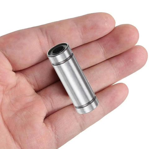 Hand holding LM10LUU Linear Ball Bearing with 10mm bore, showcasing metal finish and rubber sealing for CNC and 3D printers.