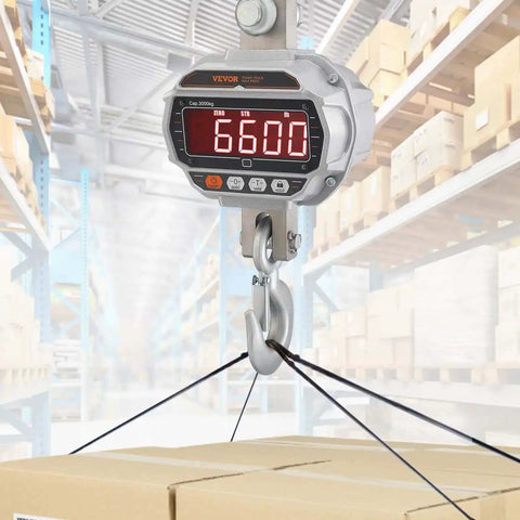 Digital Crane Scale 6600 Lbs 3000 Kg Heavy Duty Hanging Scale With Remote Control LED Display 5 Digit Readout 4 cm Tall Digits, shown weighing boxes in a warehouse.