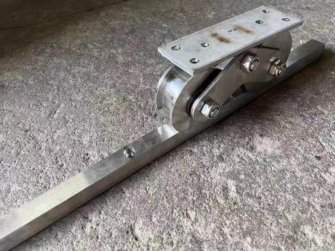 Side view of Go To Heavy Duty Groove Wheel Pulley Set With 304 Stainless Steel Bearings For Wire Lift on concrete surface