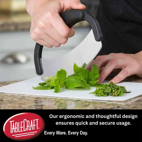 Crinkle Cutter Mezzaluna For Veggies And Fruits One Handed Stainless Steel Rocking Knife chopping herbs on a cutting board