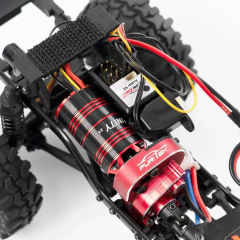 Unity24 Pro 3500Kv 2-In-1 Micro FOC Brushless System installed in Axial SCX24 RC Car showing motor and ESC combo close-up