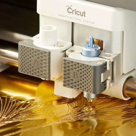 Close-up of Cricut machine using Shine Your Diy Cards And Invitations With A Foil Transfer Kit That Includes 12 Foil Sheets 3 In 1 Tool Set