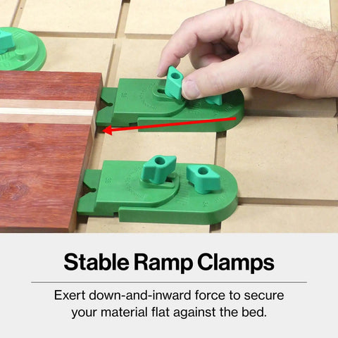 MatchFit CNC Clamping Kit For Woodworking And Milling, 11 Piece Green Set showing ramp clamps securing wood on CNC bed