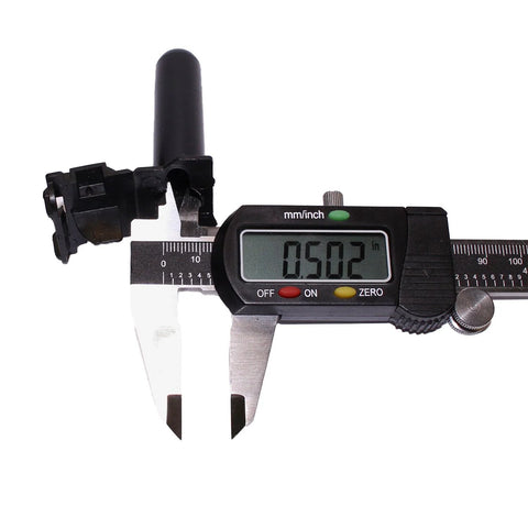 Black plastic wire splice connector housing shown with a digital caliper reading 0.502 in.