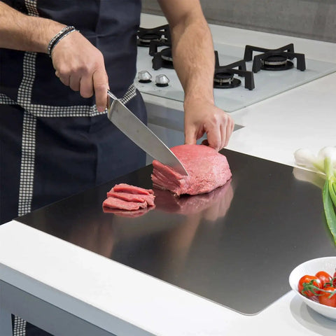 Man using Stainless Steel Cutting Board For Kitchen, Heavy Duty Metal Chopping Mat For Meat, Fruits, Vegetables, Bread And Baking, 40 X 30 Cm