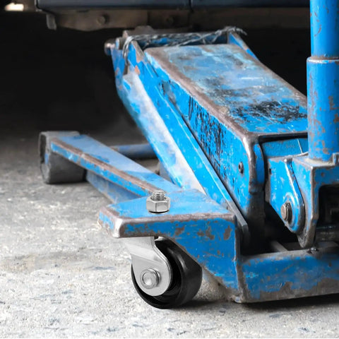 Universal Hydraulic Floor Jack Caster Wheel Replacement 2.75x1.96x1.57 In installed on blue jack in garage setting