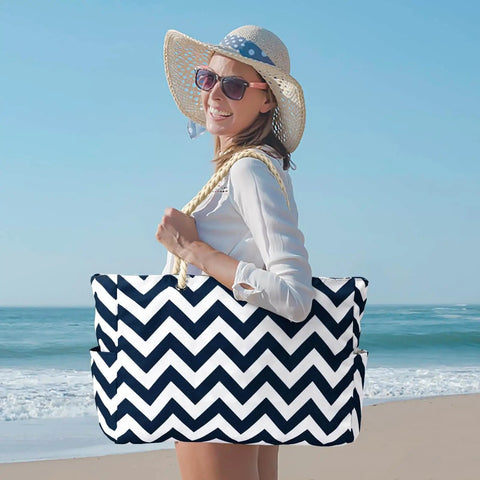 Woman on beach holding Go To Beach Tote Bag For Women With Zipper Waterproof And Sandproof Huge Capacity Holds Towels Sunscreen Clothes And More