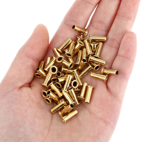 Brass compression sleeves for 1/4 in ID tubes, 4 mm OD, gold, 50 pcs in palm