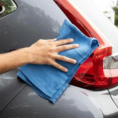 Hand using Virgin Surgical Lint Free Blue Cotton Huck Towels 5 lb Box 16 by 25 Inch on car surface for polishing