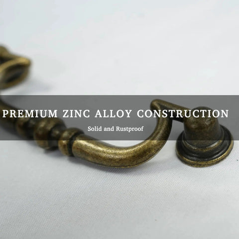 Close-up of Vintage Drop Bail Drawer Pulls Set In Antique Brass 6 Pack For Furniture Restoration, showing premium zinc alloy construction