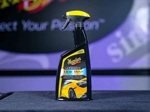 Ultimate Quik Wax With Hydrophobic Polymer Technology For Long Lasting Protection, Easy On And Off No Fuss, Superior Water Beading And Deep Wet Look Shine For Your Car, 709mL Meguiar's in spray bottle on display.