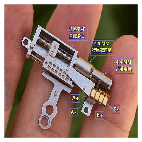 Close-up of a 11.5mm Stroke Linear Actuator With 5mm Precision Planetary Gearbox Pro Grade held on fingertip showing gearbox details.