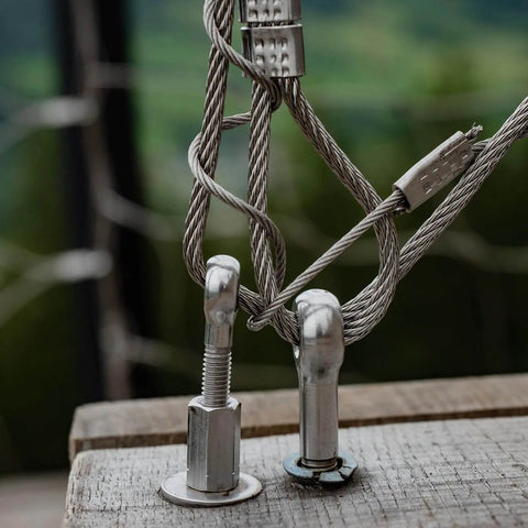 M5 x 25mm 304 Stainless Steel Eye Bolt for rigging and lifting, installed in wooden surface with cables attached, side view