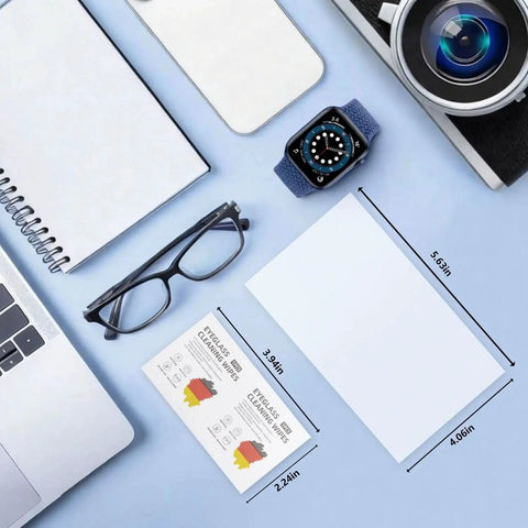 Pre Moistened Lens Wipes For Eyeglasses AR Coated Lenses Screens Streak Free shown alongside eyeglasses and tech items on blue background.