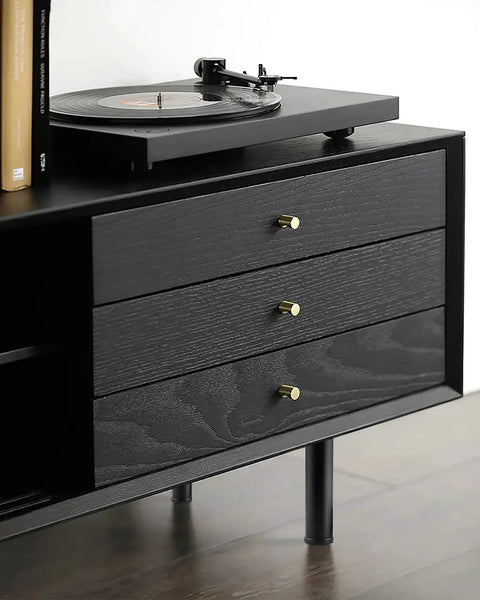 Black dresser with 4 Pack 6 Inch Metal Cylinder Furniture Legs With M8 Screws Black Finish Durable Replacement Feet shown under it