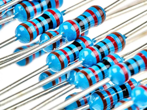 Blue axial resistors with color-band markings; assorted resistor kit components