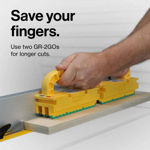 Person using two GRR Ripper 2GO Push Block For Routers Jointer Band Saw And Table Saw With Green Grip Non Slip Surface Extreme Grip And Precise Control To Prevent Kickback Made In USA Woodworking Tool For Accurate Cuts.