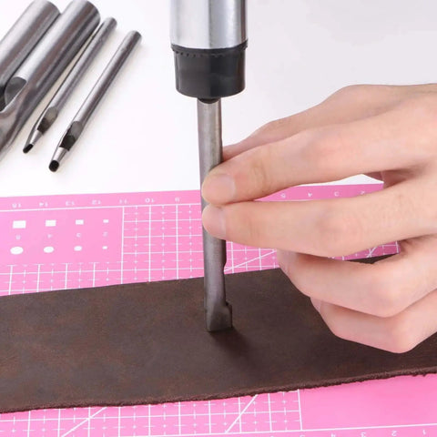 Using 9 Piece Stainless Steel Leather Hole Punch Set With A5 Cutting Mat For Leather, Canvas on brown leather strip