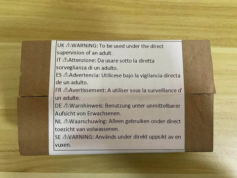 Cardboard box with multilingual warning label advising adult supervision for usage.