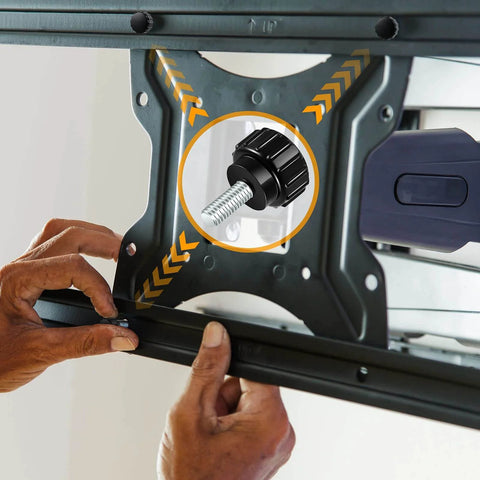 Person installing monitor mount with Knurled Threaded Thumbscrews M4 X 10mm For Monitor Mounts Carbon Steel Black 10 Pack