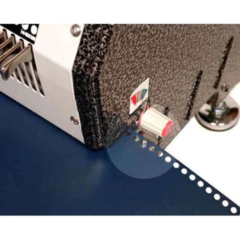 Close-up of Heavy Duty Electric Coil Punch Machine for Bindery with 4x5mm oval holes, showing punched paper with precise holes.