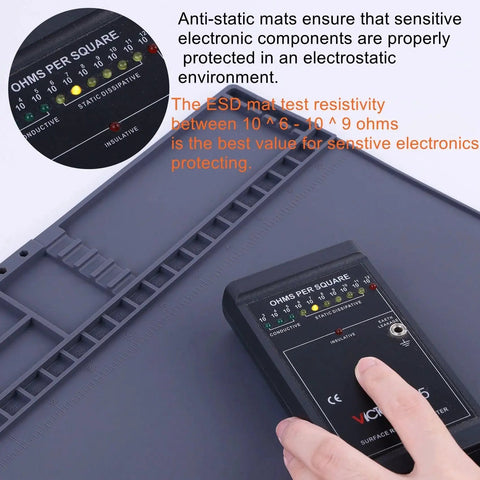 Hand measuring resistivity on Premium ESD Safe Magnetic Anti Static Electronics Work Mat With Grounding Accessories 932 F Heat Resistant