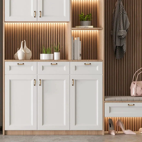 Antique Brass 3 Inch Cabinet Handles on white kitchen cabinets with smooth edges, part of set of 5 in solid zinc alloy for versatile mounting.