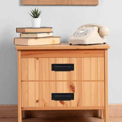 Wooden cabinet with set of 10 industrial cast iron drawer pulls in black, installed for vintage rustic kitchen hardware
