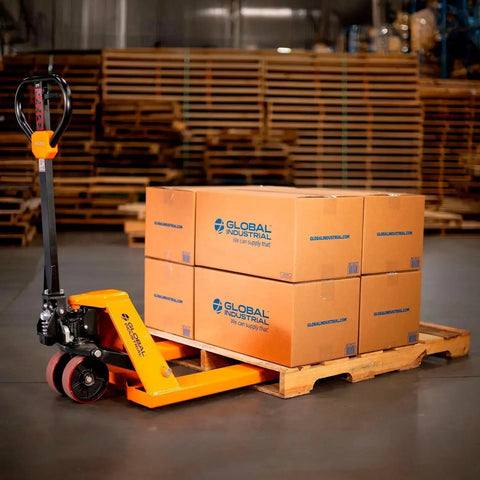 Pallet jack, Global Industrial orange, side view, lifting a pallet of four cardboard boxes.