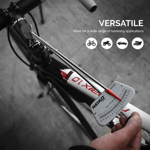 Using 1/4-Inch-Drive Beam Torque Wrench With Dual SAE And Metric Readings on a bicycle for precise tightening, close-up view