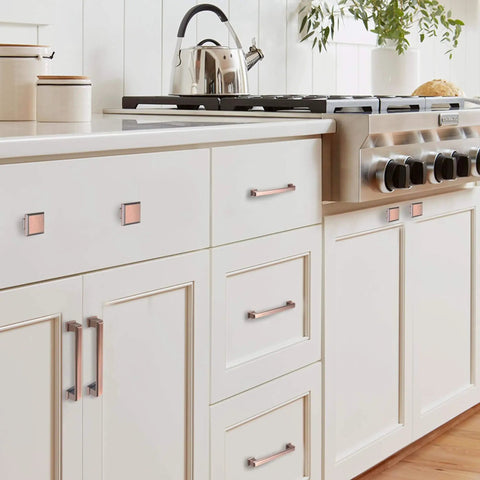 Brushed Antique Copper Kitchen Cabinet Pulls And Knobs Set, 5 Inch, installed on white cabinets in modern kitchen
