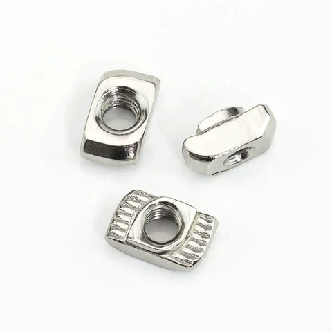 Three nickel-plated T-slot nuts from 160 Piece Hammer Head T Slot Nut Kit For Aluminum Profiles M3 M4 M5 Drop In Nuts Built Tough