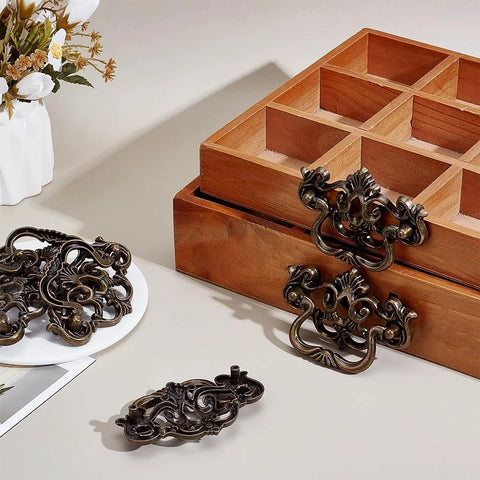6 Pack Antique Drawer Pulls For Dresser And Cabinet, Vintage Bronze Finish 4 Inch Handles displayed with wooden drawer and flowers.