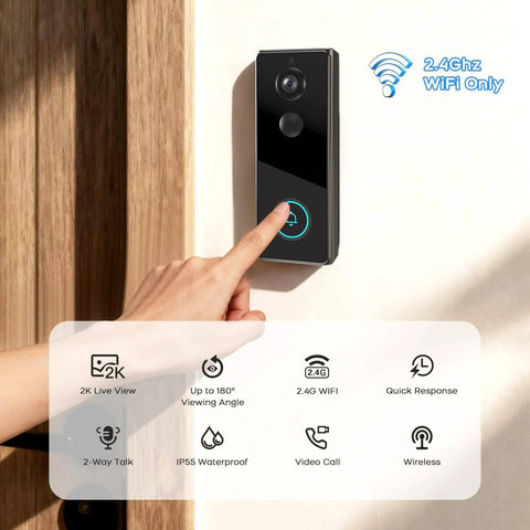 2K Wireless Video Doorbell Camera With Live View Color Night Vision Smart Human Detection mounted on a wall with a hand pressing button