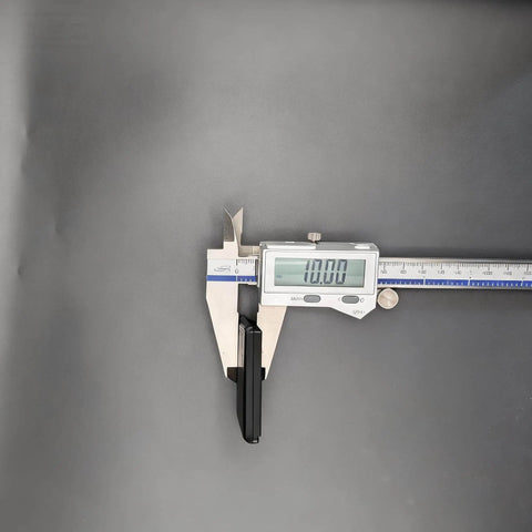 Digital caliper measuring a 4 Piece Magnetic Hold Down for Laser Engravers Rock Solid Magnetic Clamps with 10mm Grip.
