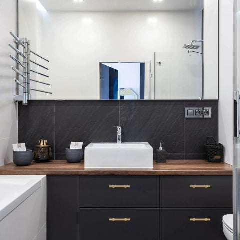Bathroom vanity with 6-Pack Solid Brass Cabinet Pulls in Brushed Gold Finish, single hole, on modern furniture